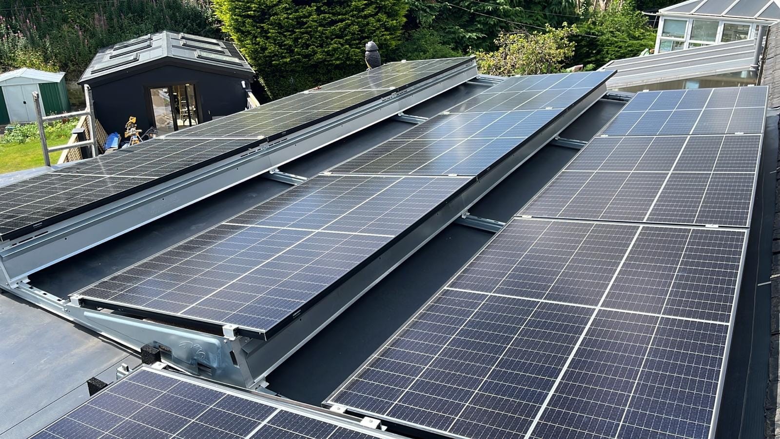Solar PV Panels installed on a flat roof of a residential house