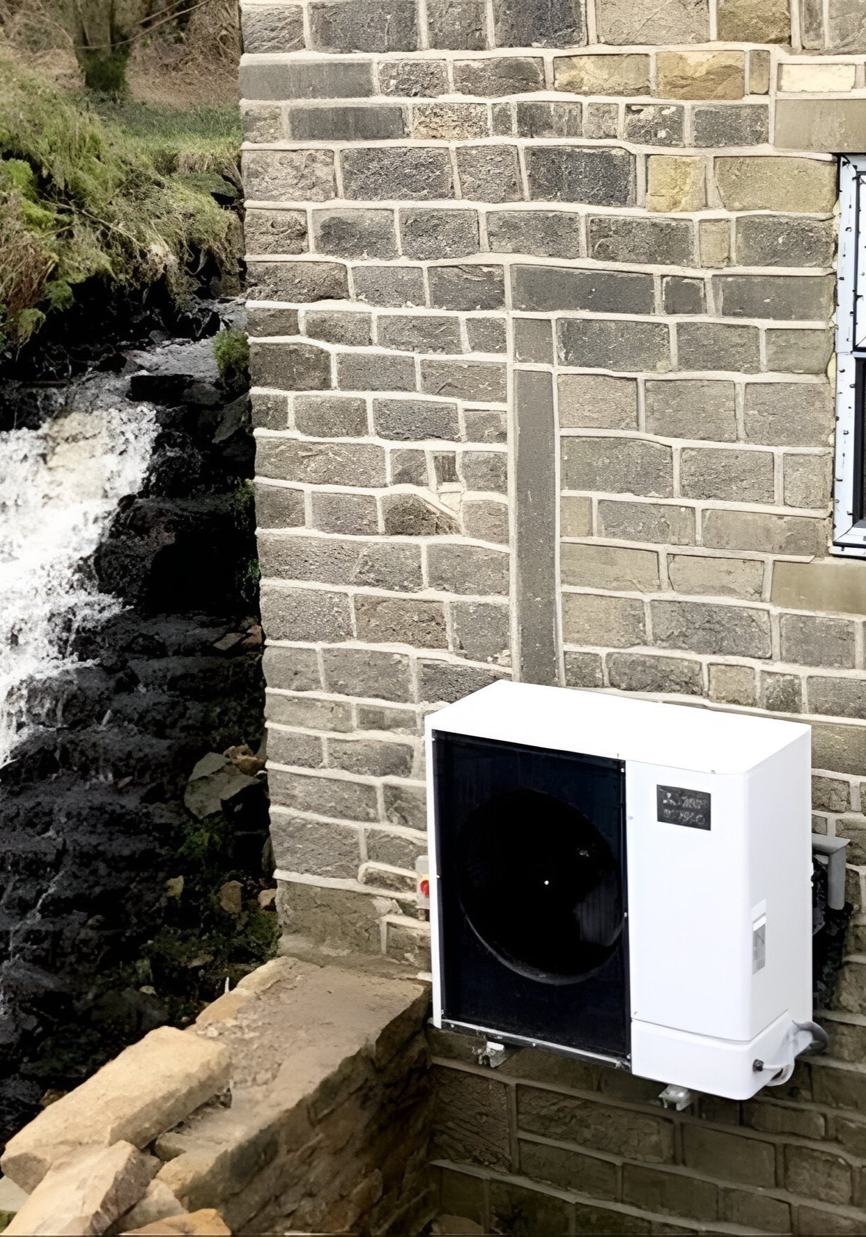 An air source heat pump installed on the exterior wall of residential house