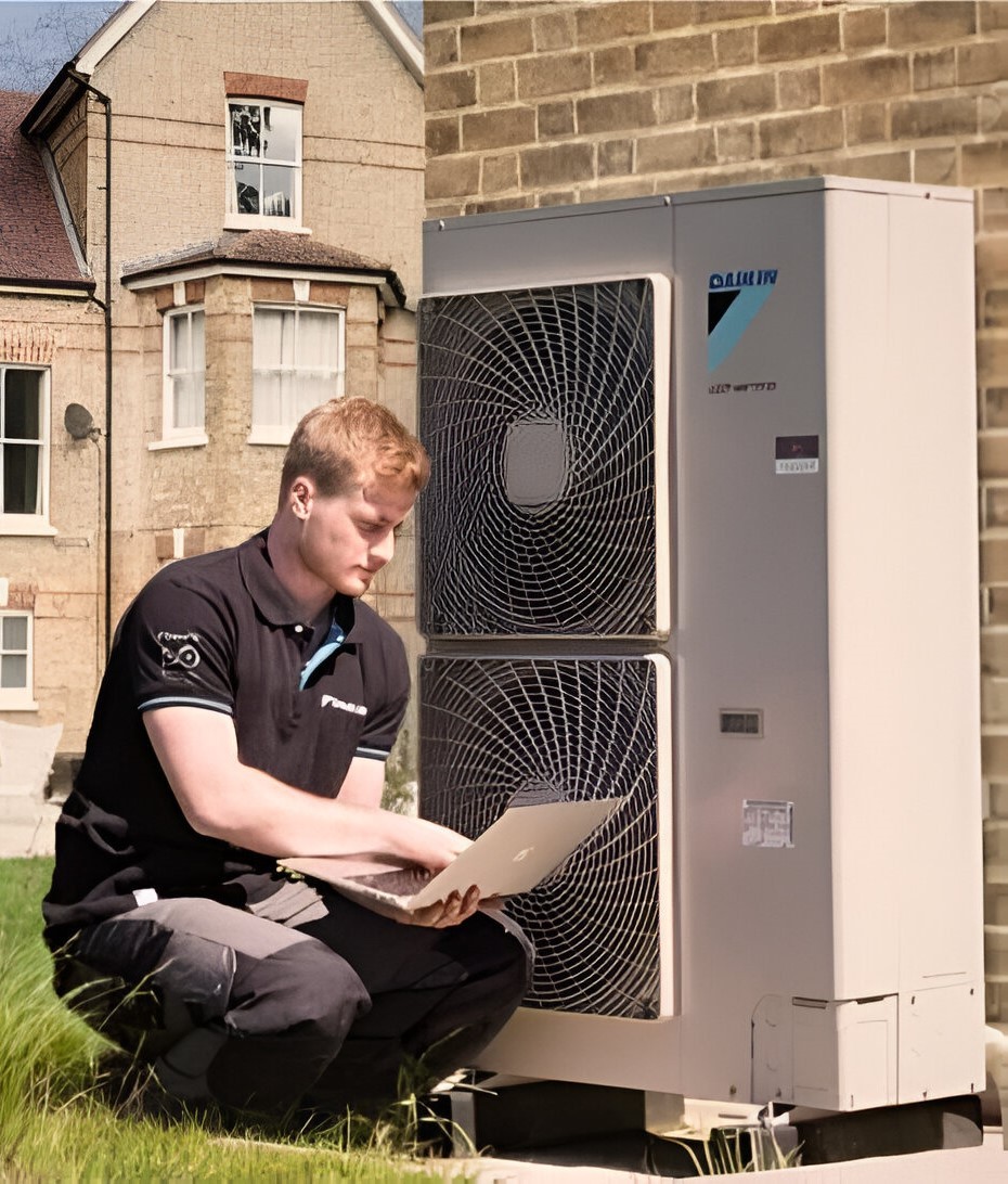 Specialist configuring Air Source Heat Pumps (ASHP)
