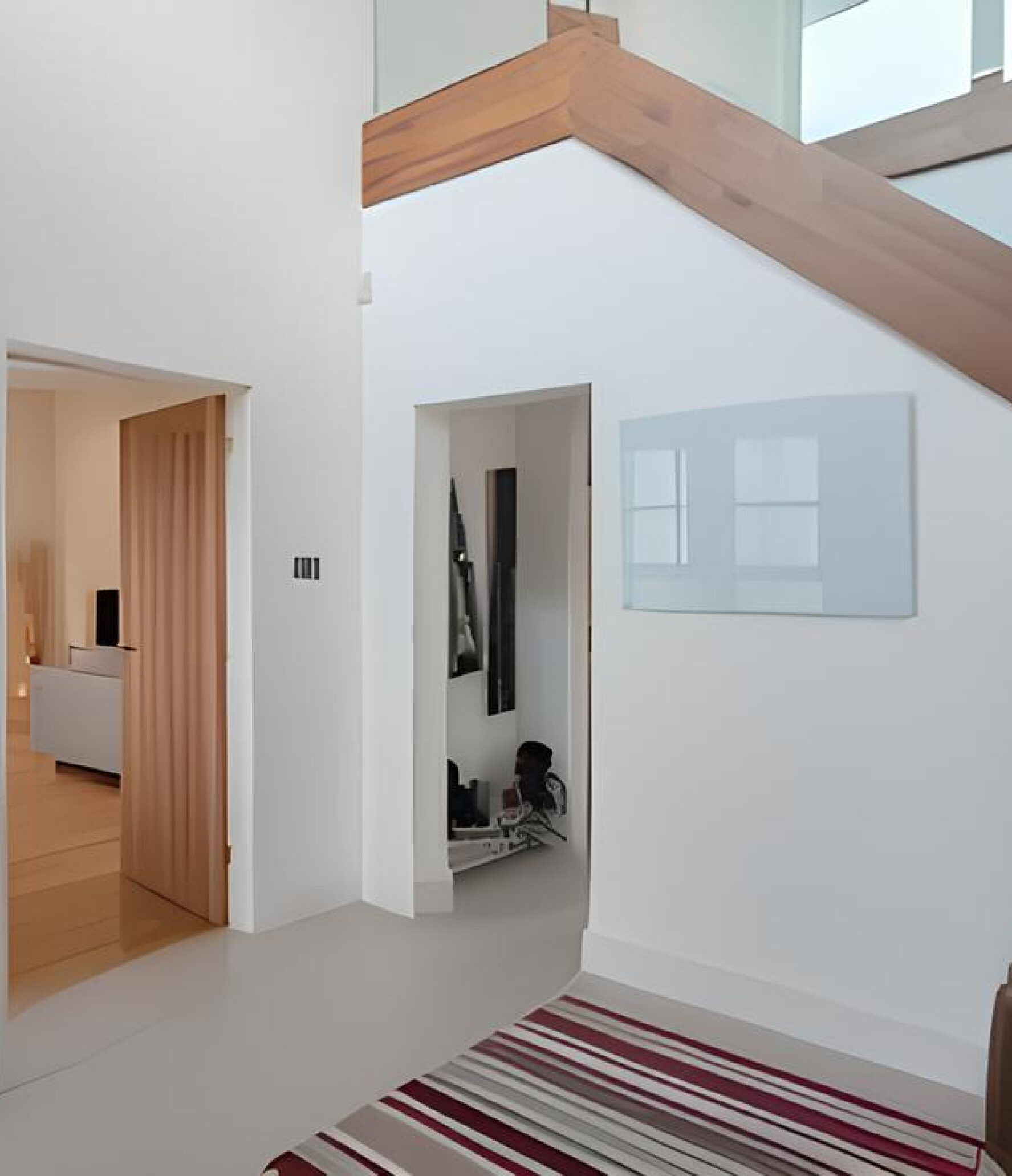 White electric panel heater mounted on a wall.