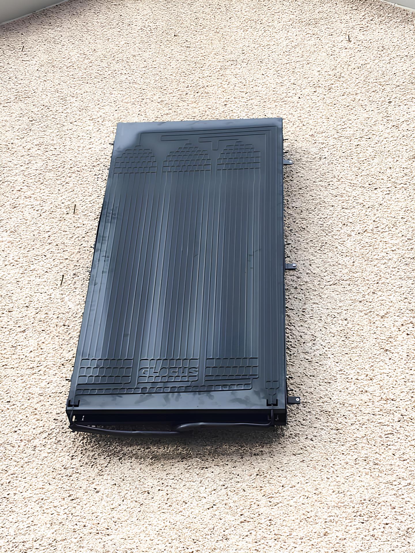 A single solar thermal panel mounted on the side of a house in Fife.