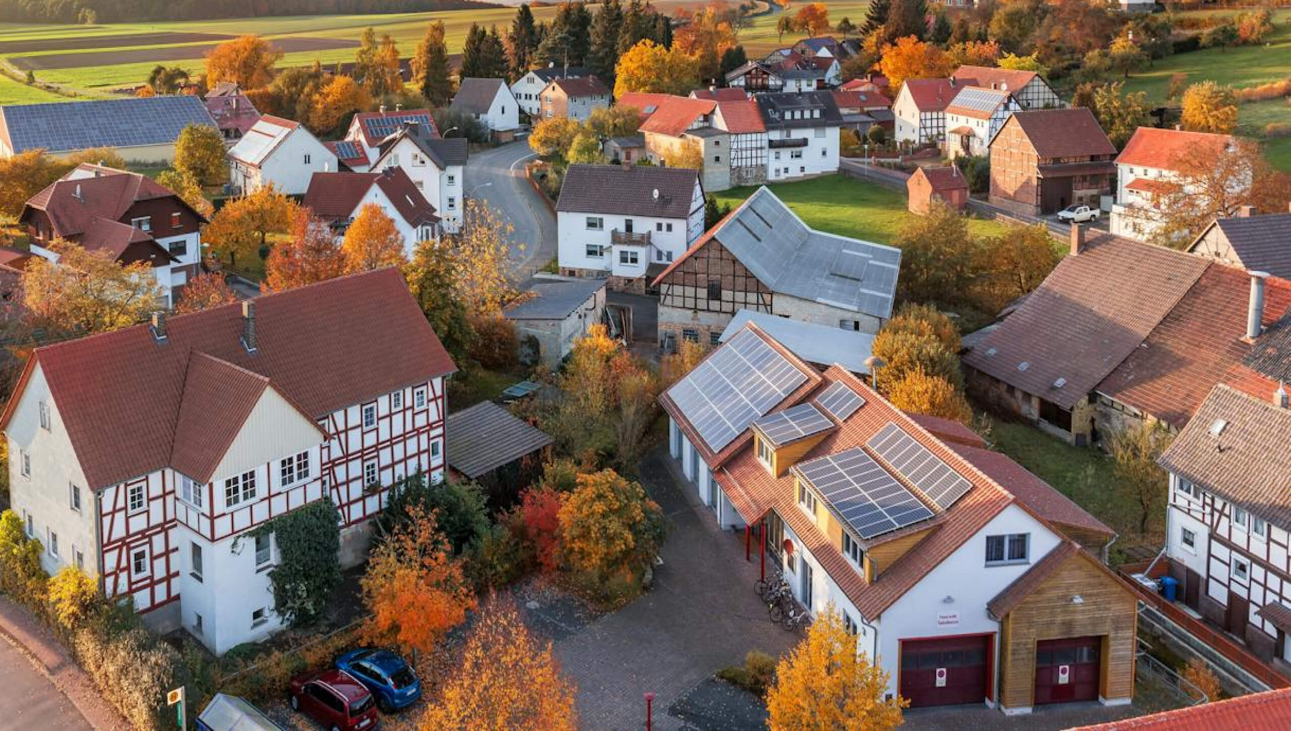 Multiple energy-efficient homes equipped with high-performance solar PV panels, reducing reliance on traditional electricity sources.