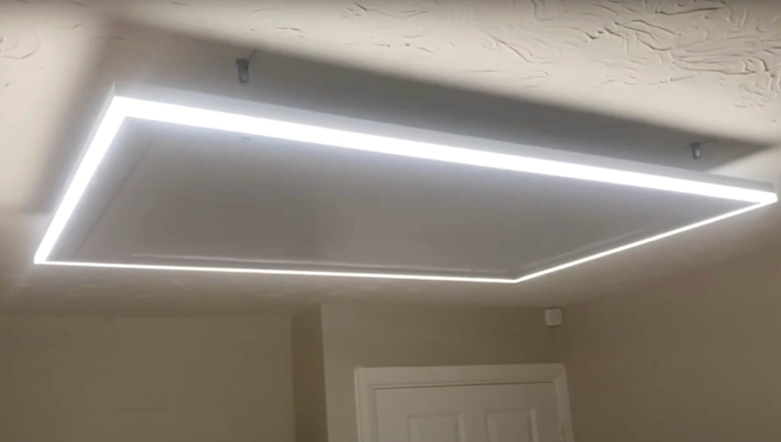 A professionally installed infrared heating panel in a residential dining room, providing consistent and safe warmth throughout the space.