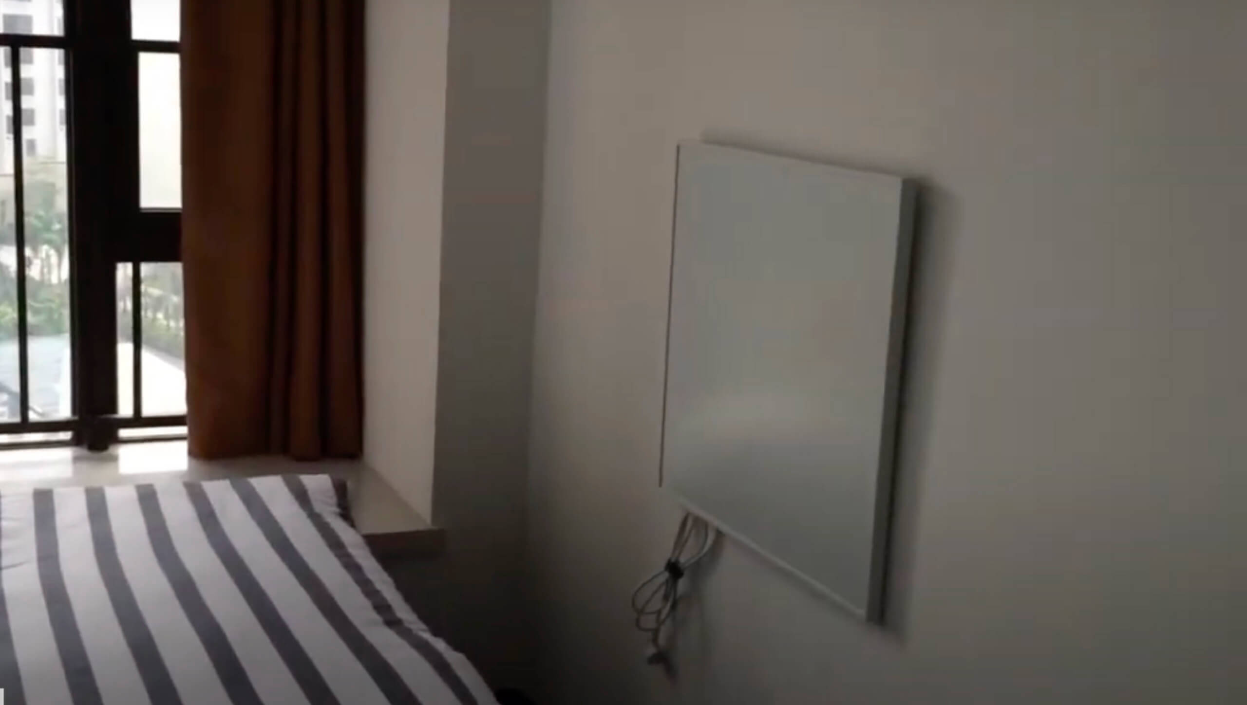 An infrared heating panel safely installed in a bedroom, providing even and efficient warmth without air circulation issues.