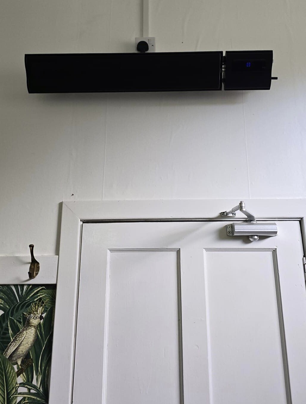 infrared heater installed at the top of interior wall