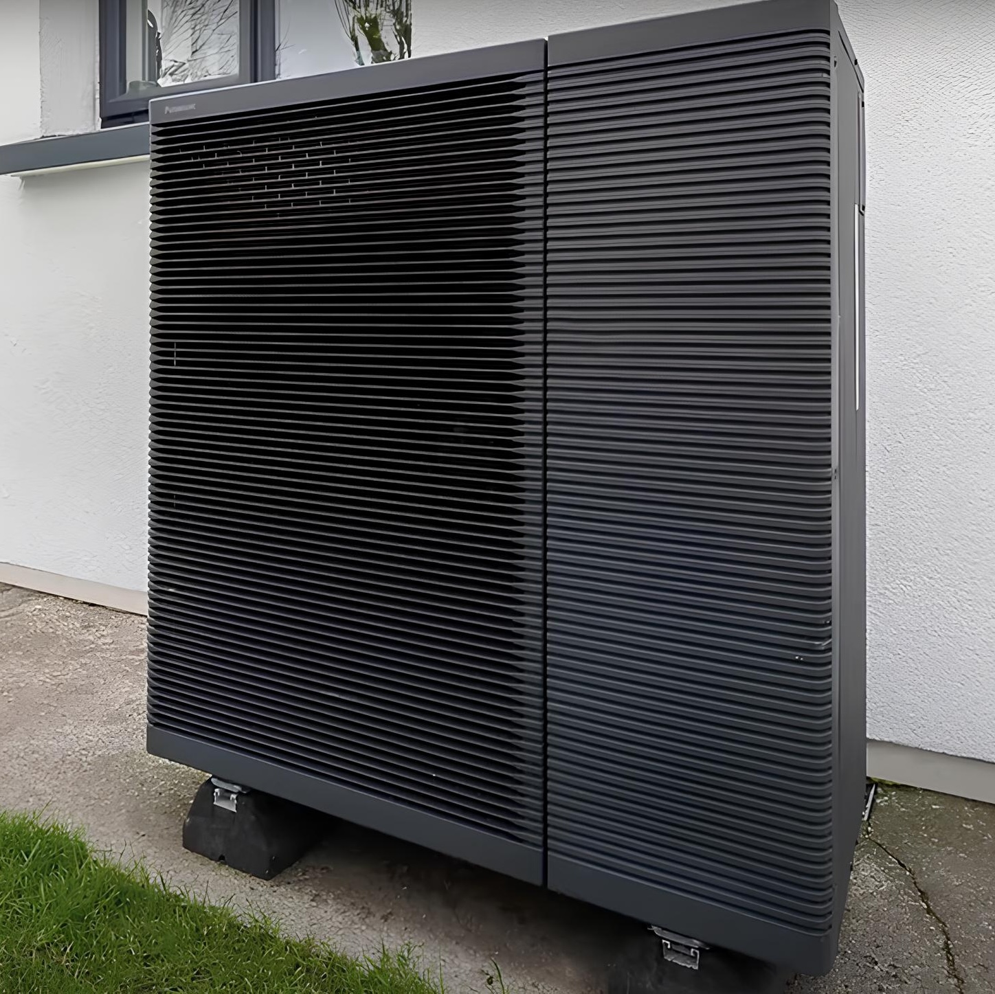 Black air source heat pump installed for a residential property