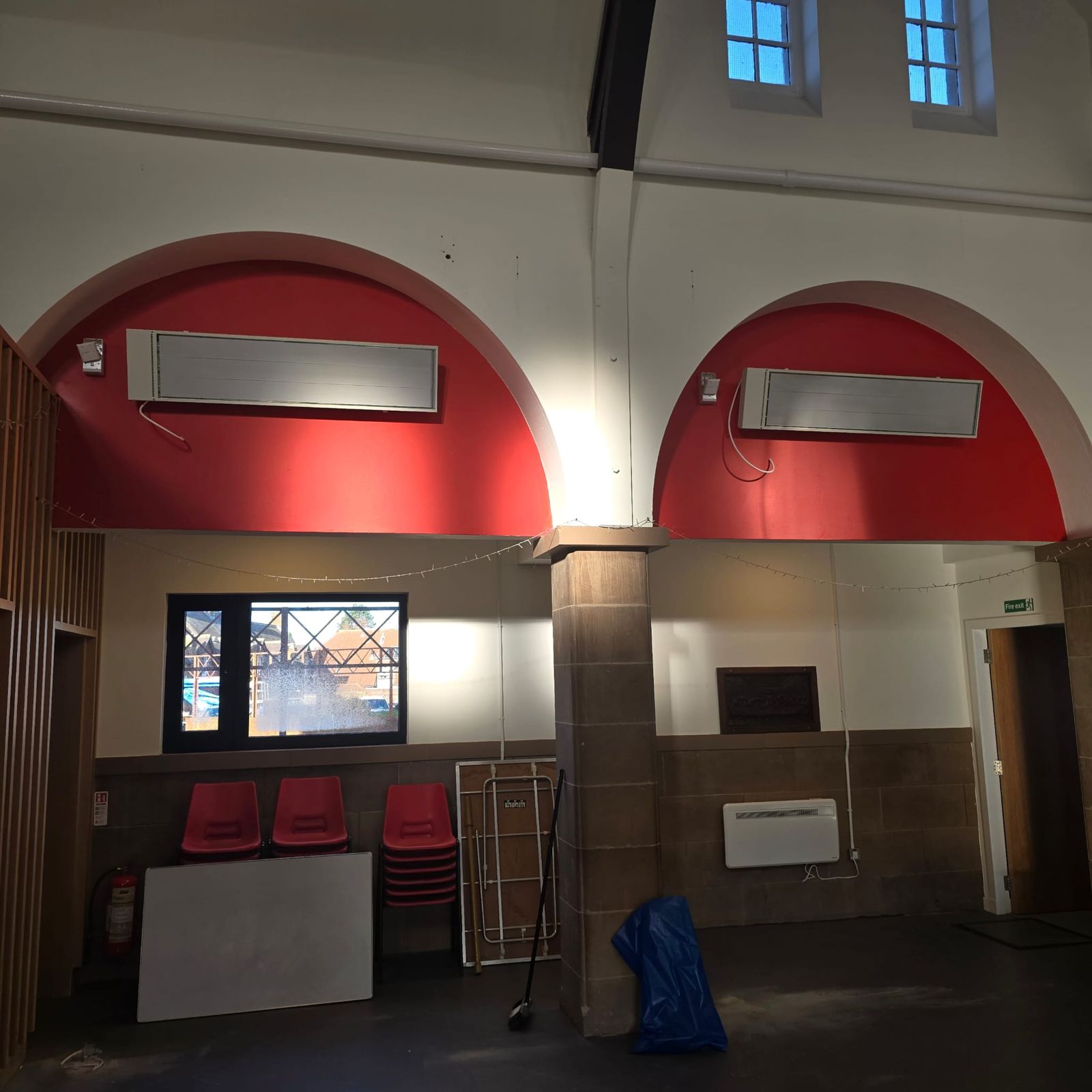Infrared heaters above church hall arches