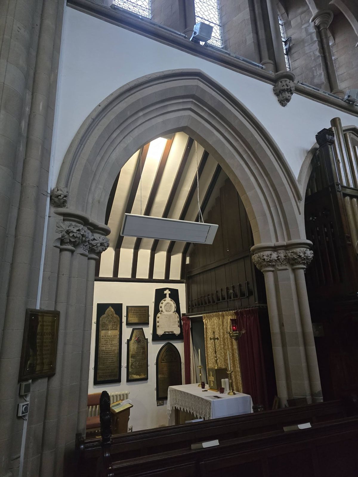 Infrared heater beneath a gothic arch