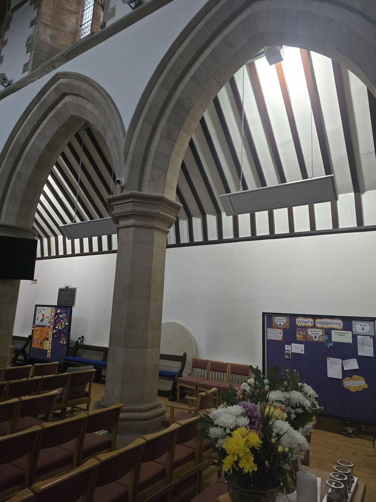 Infrared heaters above a church nave