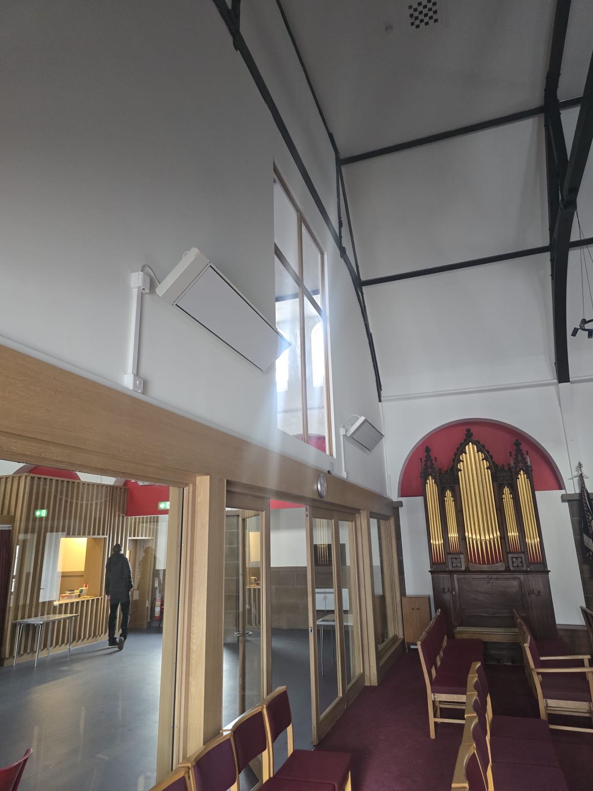 Infrared heaters beside a church organ