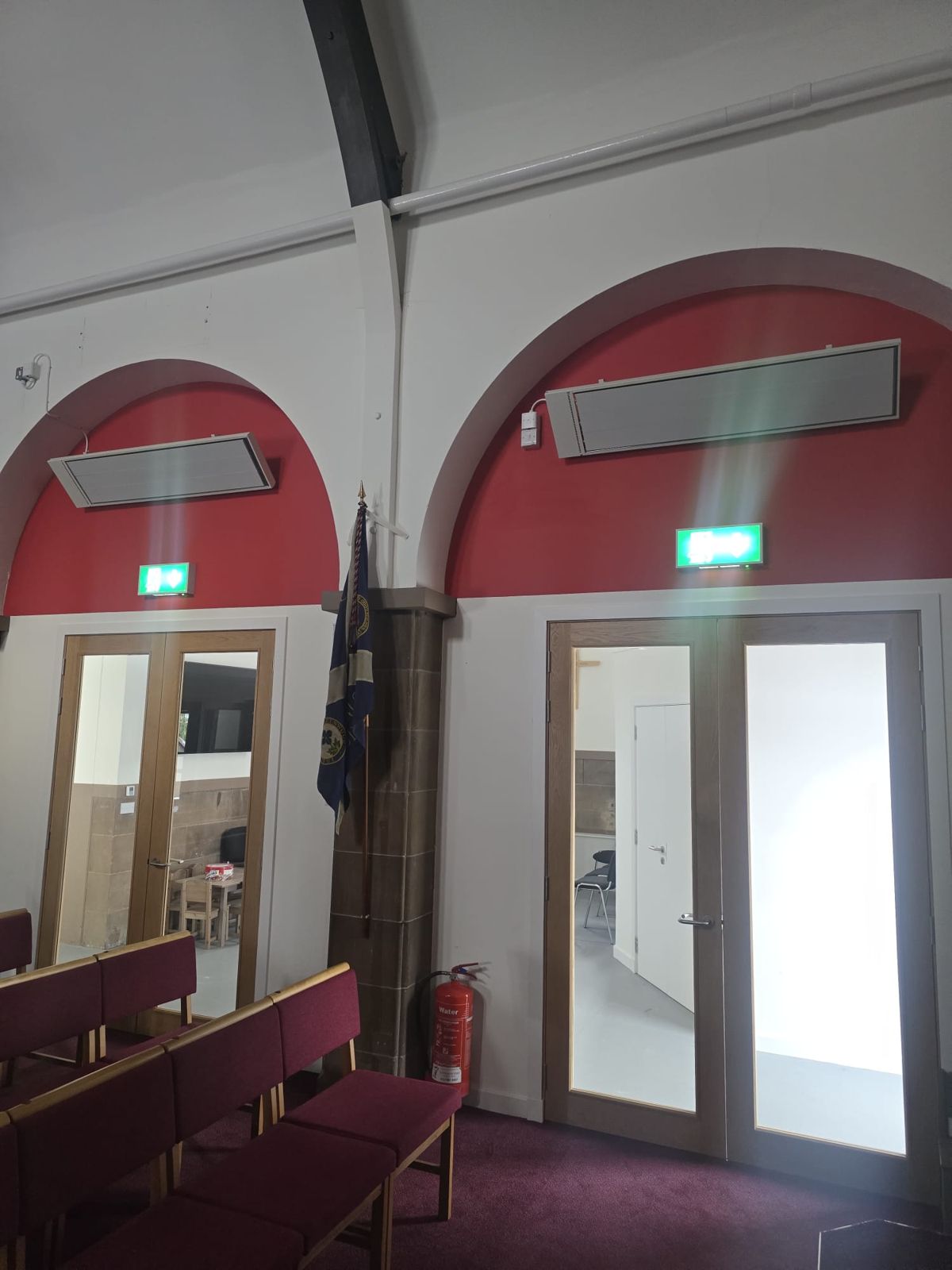 Infrared heaters above church pews, installed by Scottish Energy Saving